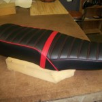 1976 motoguzzi seat redo in Black and red. New passenger strap made to use.Thanks Charlie