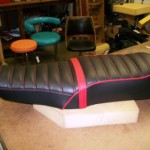 1976 motoguzzi seat redo in Black and red. New passenger strap made to use.