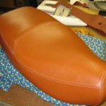 Modern vespa seat redo in leather. French seams all the way around.