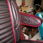 Hot rod seat in black and red. Red and white pinstripe stitching