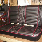 Hot rod seat in black and red. Red and white pinstripe stitching