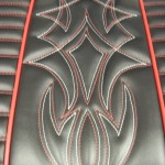 Hot rod seat in black and red. Red and white pinstripe stitching