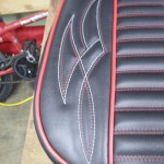 Hot rod seat in black and red. Red and white pinstripe stitching