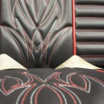 Hot rod seat in black and red. Red and white pinstripe stitching